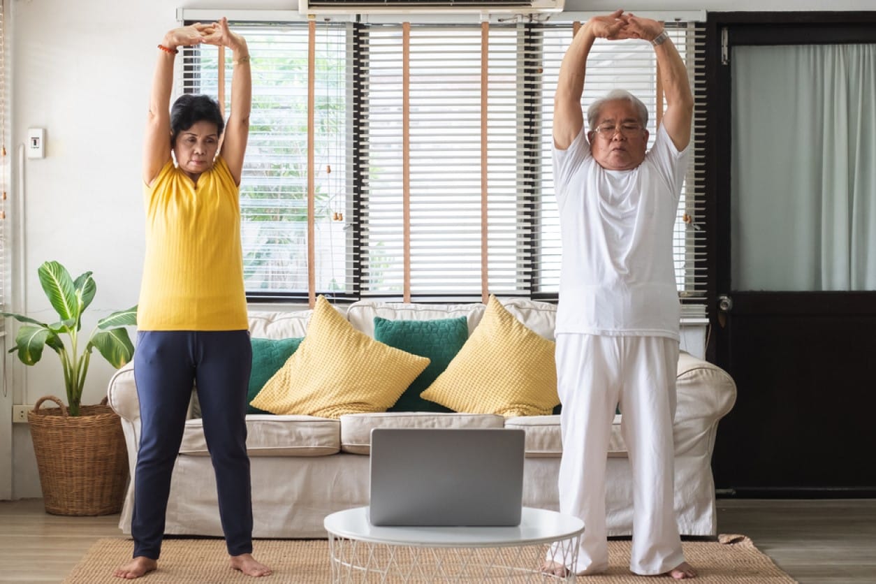 Senior citizens working out at home