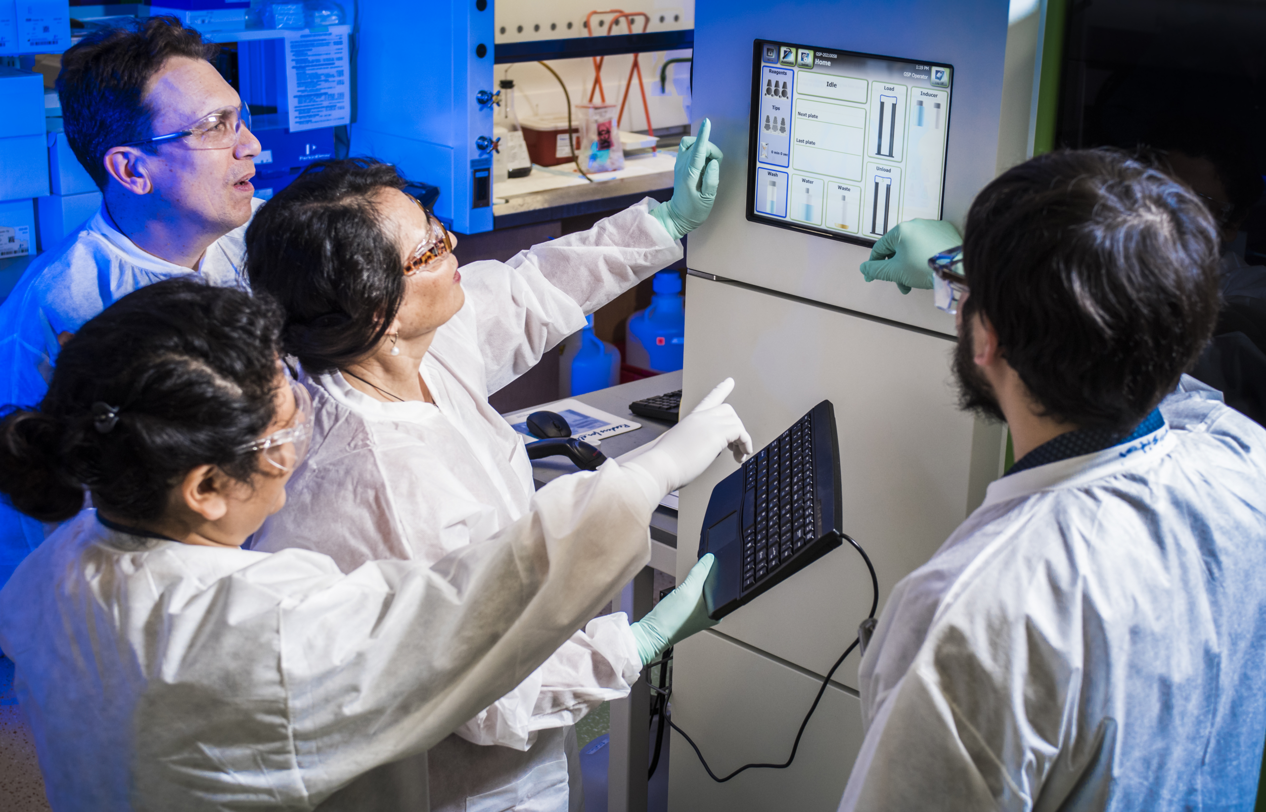 Male and female scientists working together in laboratory