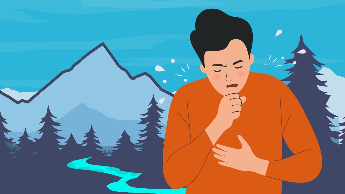 man coughing with mountains, trees, and a river in the background