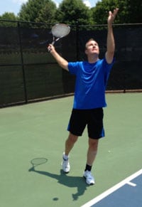 Rick playing tennis.
