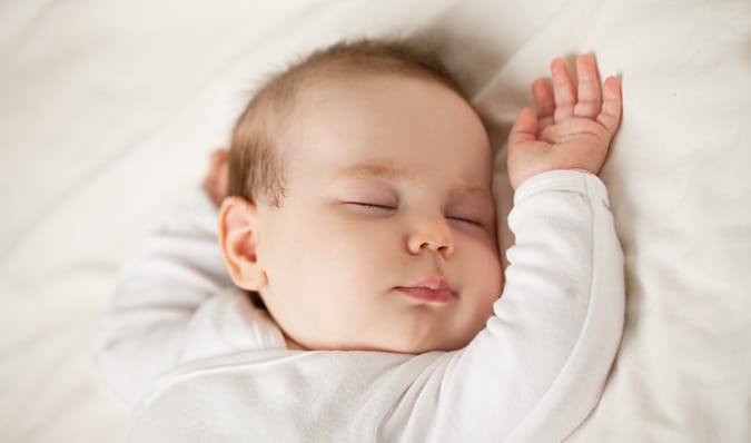 Botulism alert with sleeping baby warning parents to not give babies honey pacifiers