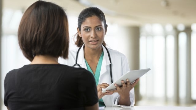 A patient consulting with a physician.