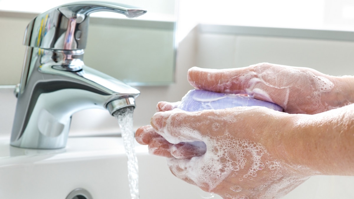 a person washing their hands