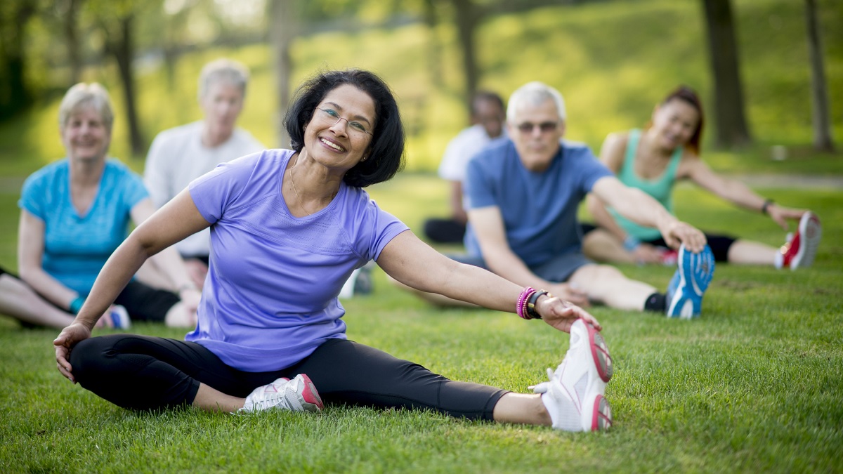 Photo of a diverse group of people exercising outside