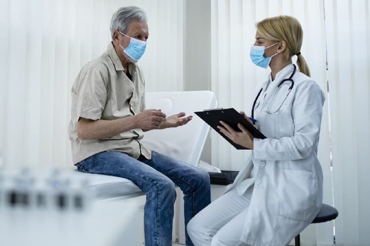 Photo of a patient talking to his doctor