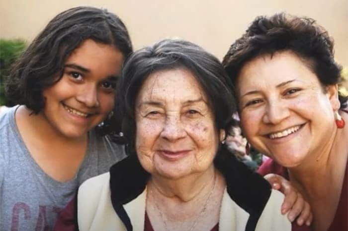 Photo of three women: a young girl with her mother and grandmother