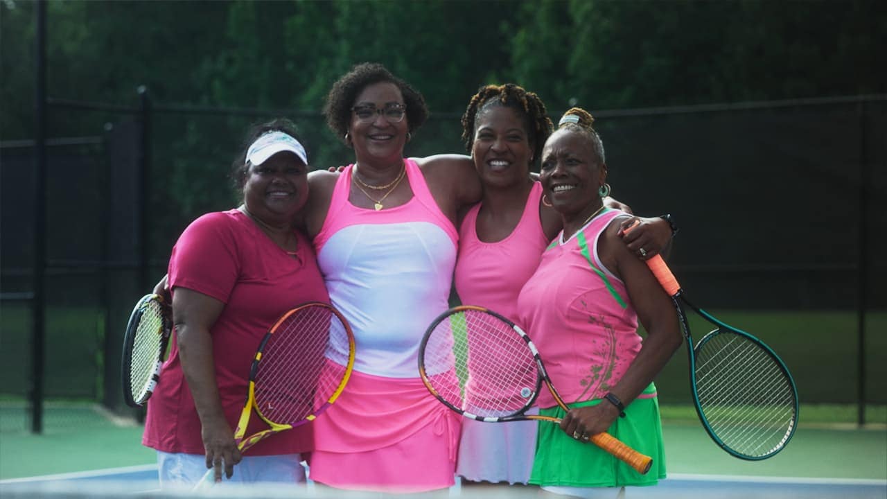 Photo of Carletta with her friends playing tennis