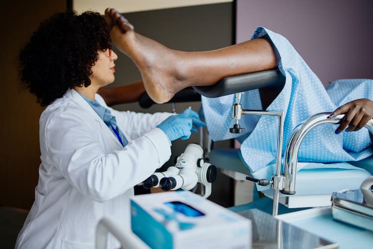 Photo of a gynecologist performing a Pap test