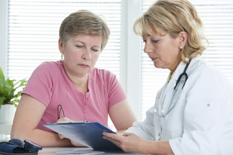 A doctor providing results to her patient.