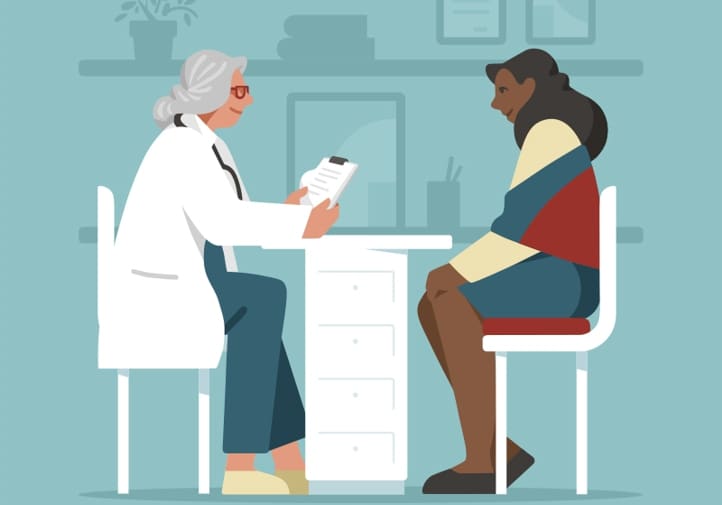 Image of a woman talking to her doctor