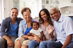 Photo of grandparents, parents, and a baby