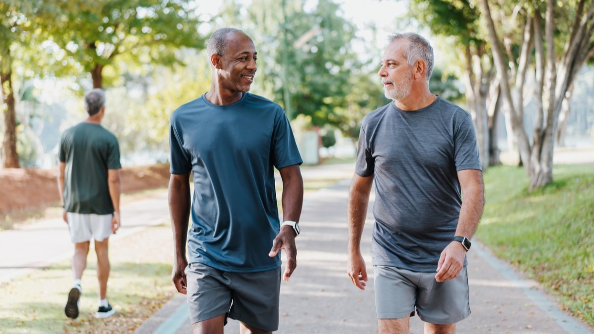 Two men walking in a park