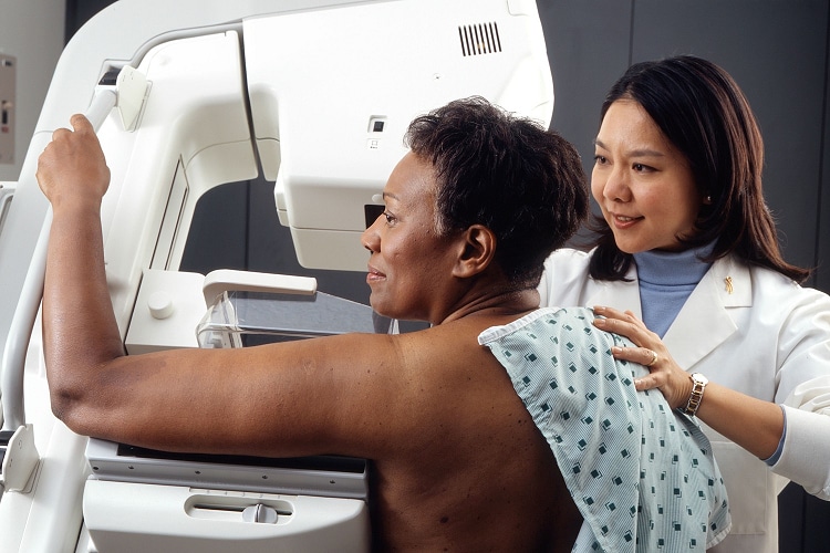 Photo of an African-American woman getting a mammogram