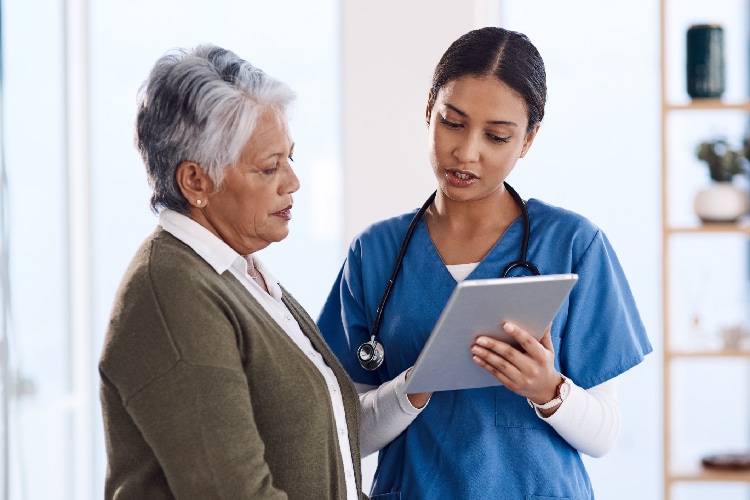 Photo of a nurse talking to a patient