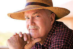 Photo of a man wearing a hat.