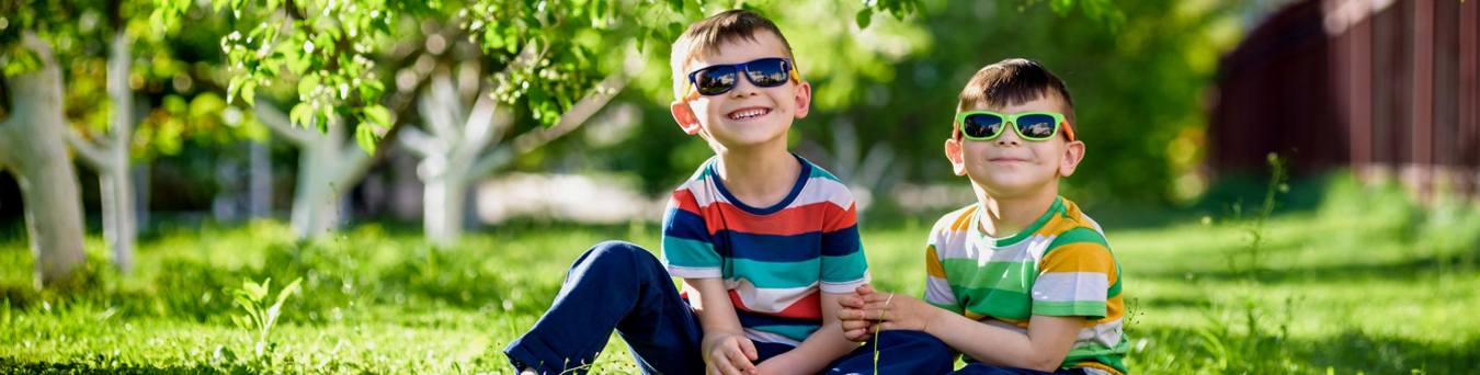 Sun Safety Tips for Families Photo of two boys wearing sunglasses