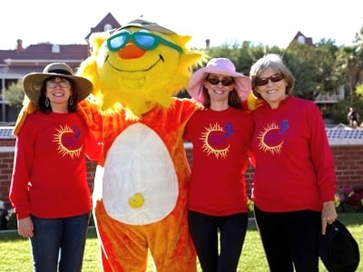 Health educators from the University of Arizona Skin Cancer Institute pose with their mascot.