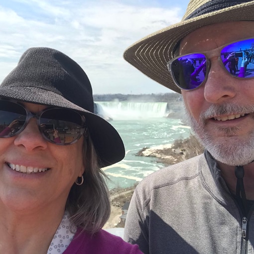 Photo of Mary and Dave safely enjoying a sunny day at Niagara Falls.