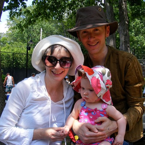 Meg Watson with husband and child wearing sun protection gear.