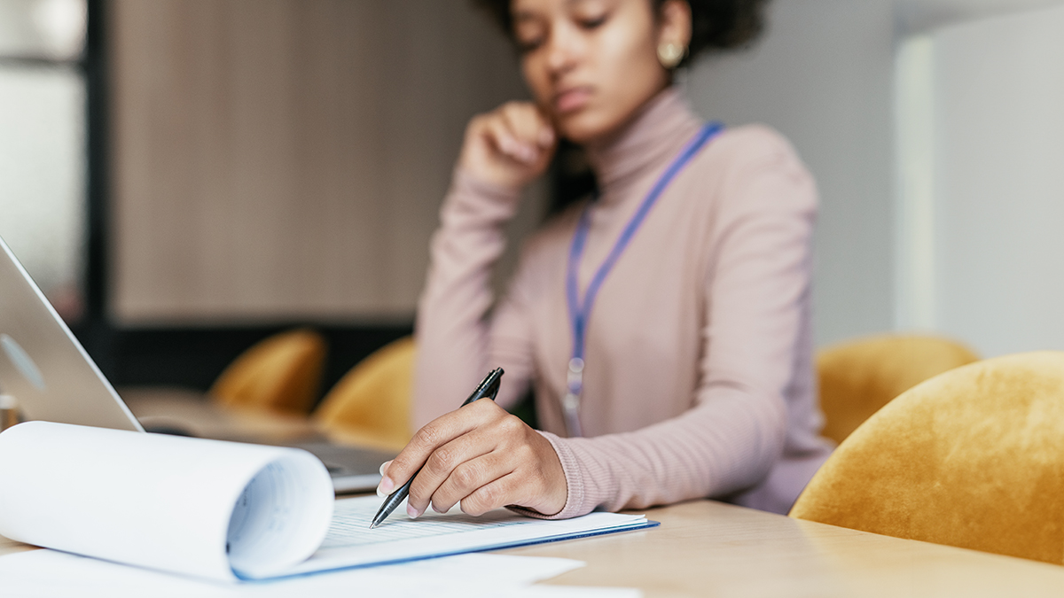 Woman going over some paperwork in an office