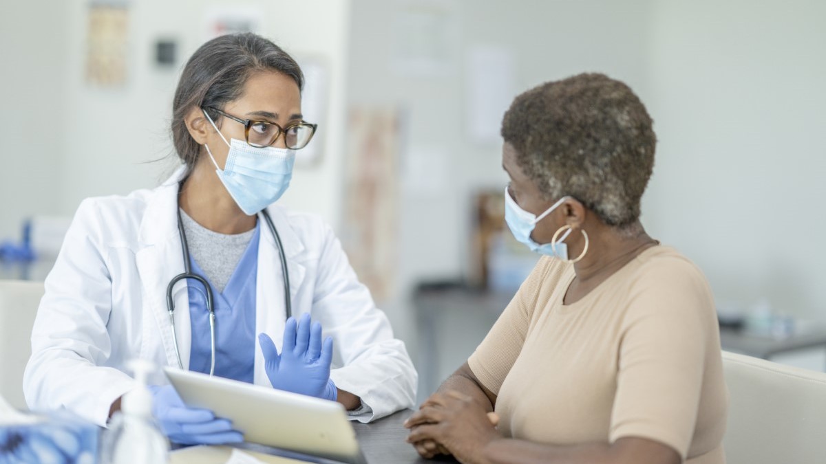 Photo of a woman talking to her doctor