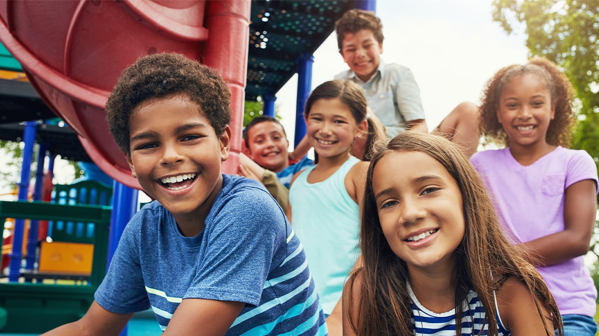 children smiling at playground
