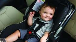 Image of toddler in a car seat.