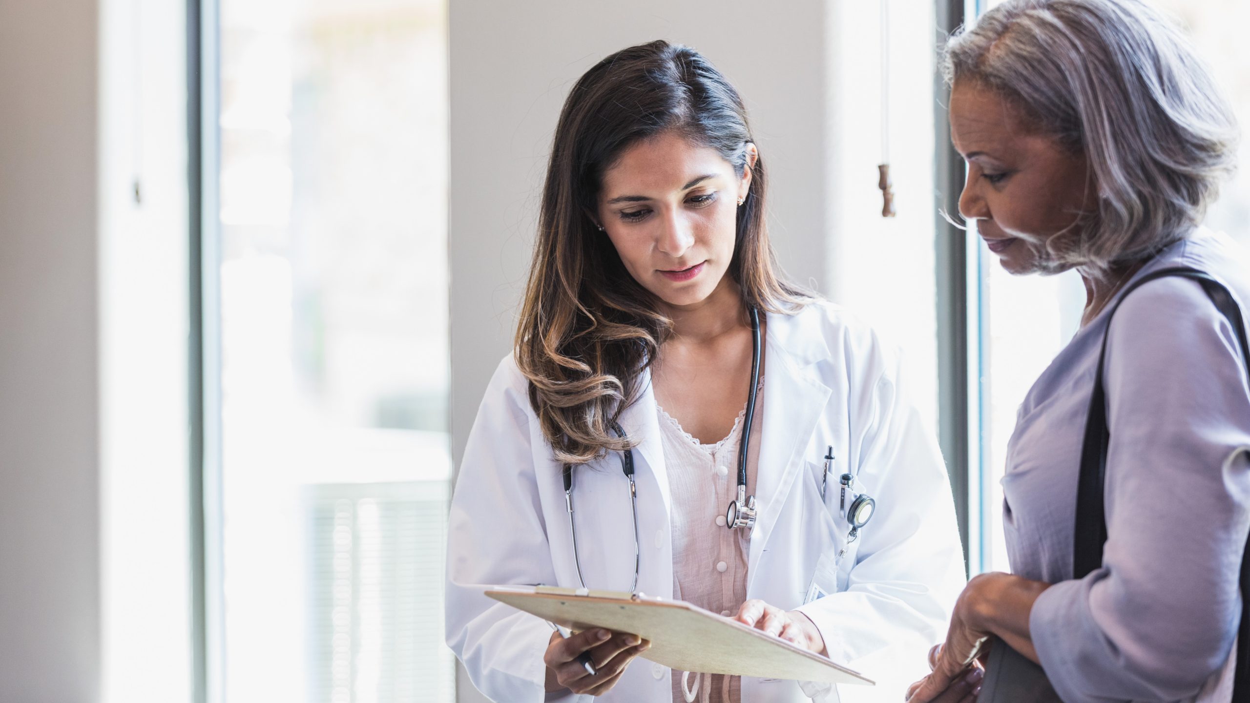 Woman talking to clinician.