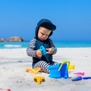 Toddler playing on the beach