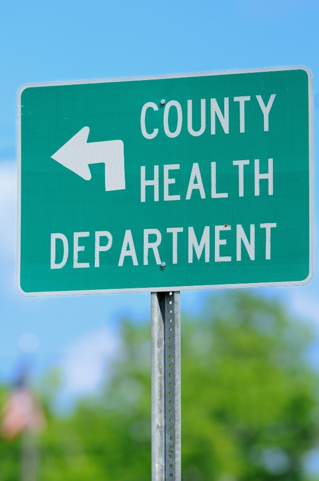 Street sign with County Health Department on it