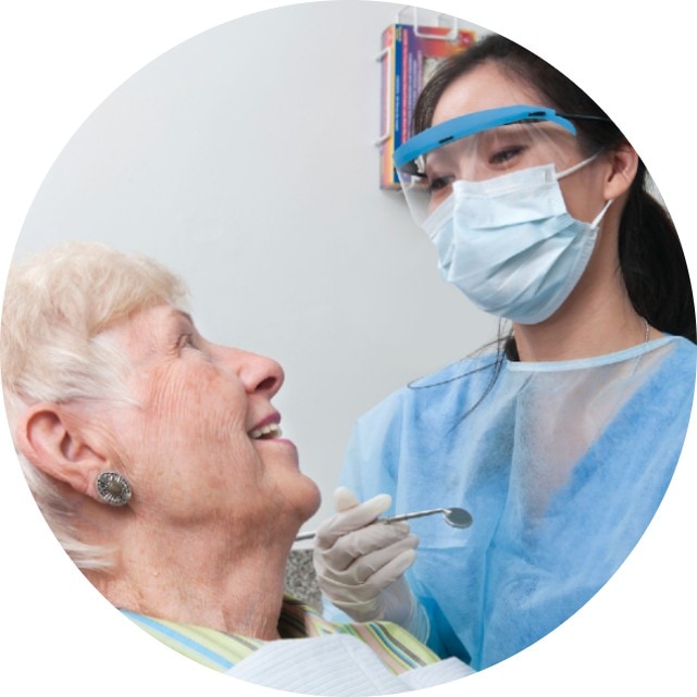 Dentist talking with a patient