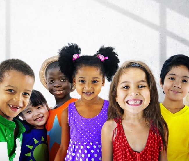 Group of racially diverse children smiling at the camera