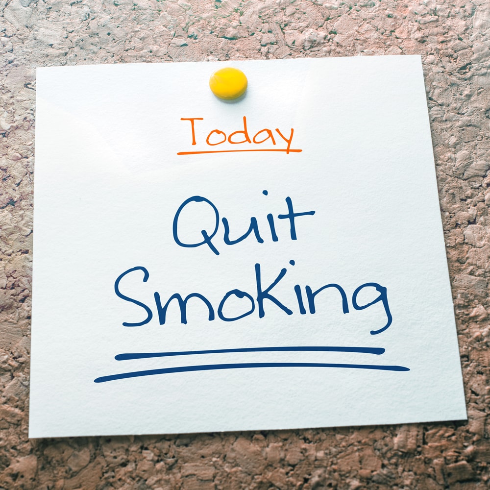 Small note stating to quit smoking today