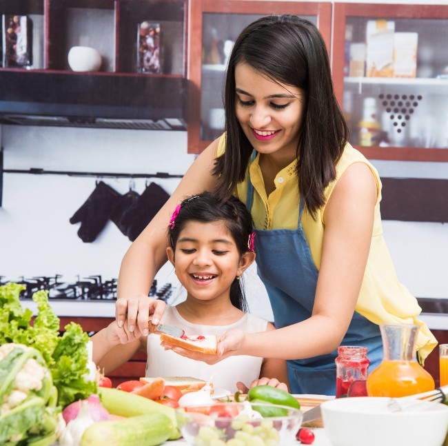 mother and daughter making healthy food