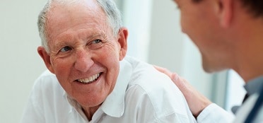 doctor and smiling male patient 
