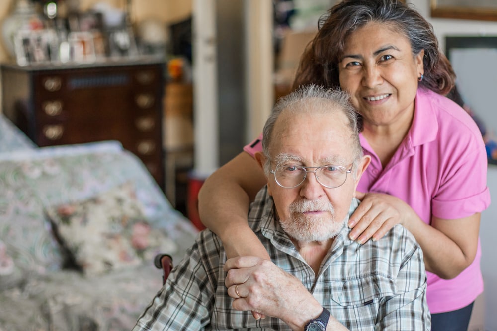 Senior man with his caregiver at home