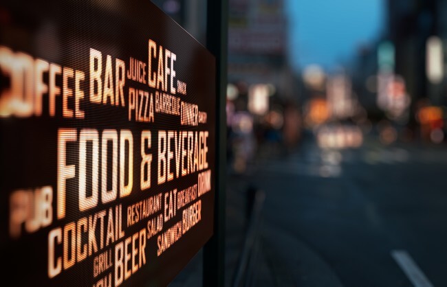 Sign with food and alcohol advertisement