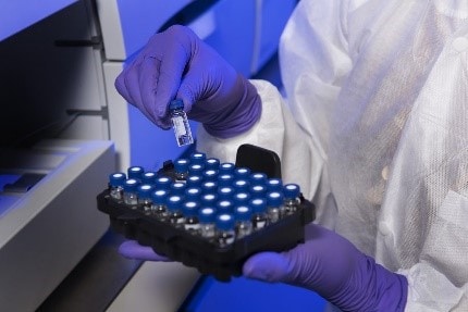 Decorative: scientist preparing samples in lab