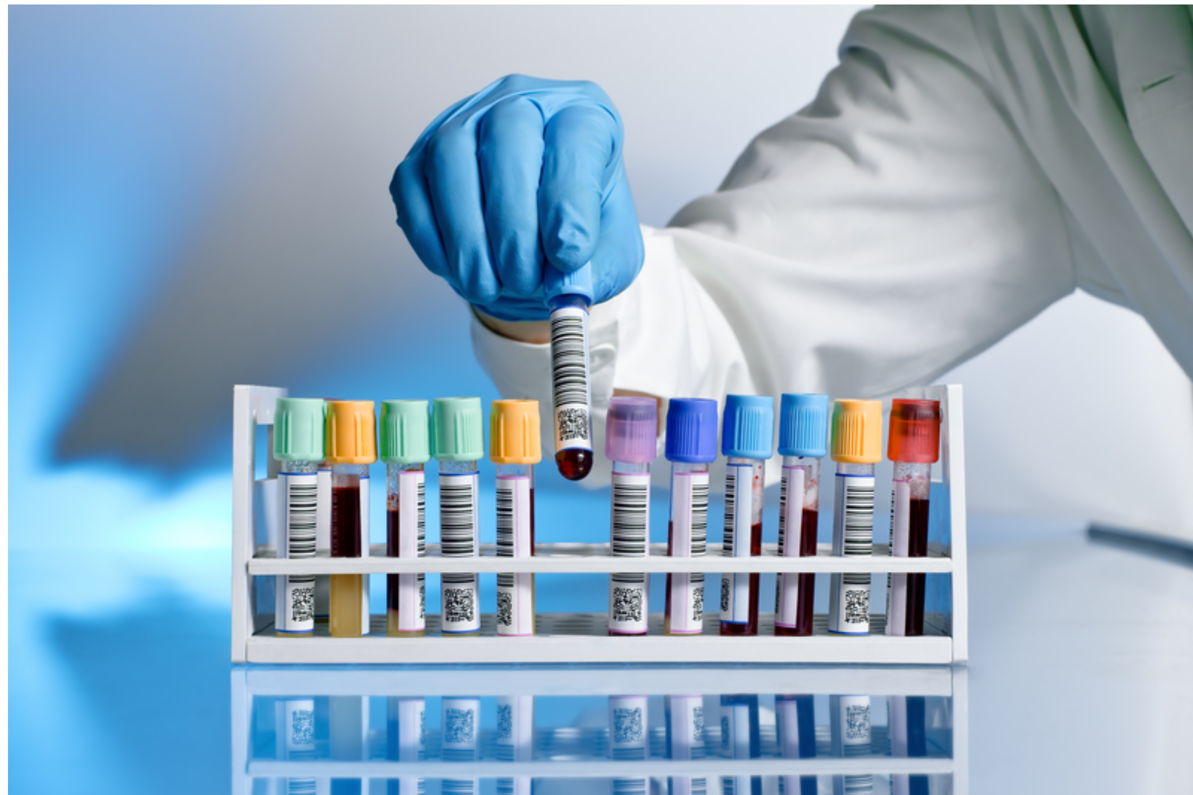 Scientist in laboratory with test tubes