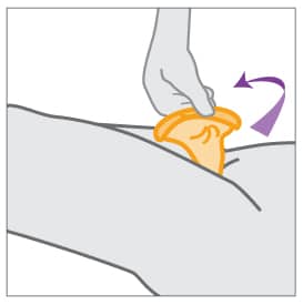 Hand removing female condom.
