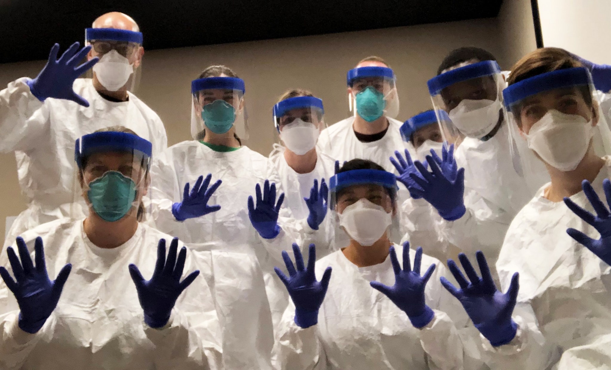 CDC deployers practice in personal protective equipment before going door-to-door to investigate a COVID-19 outbreak in Utah.  Top row, L-R: Eric Pevzner, Rebecca Chancey, Michelle O’Hegarty, Phillip Salvatore, Jeni Vuong, Henry Njuguna. Front, L-R: Vickie Fields, Cuc Tran, Katie Battey.
