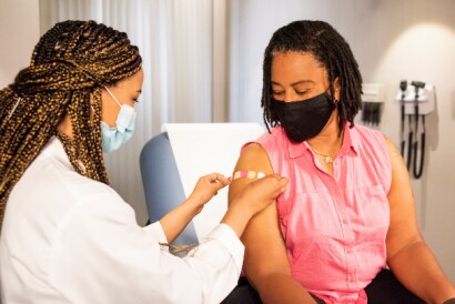 Woman receiving the vaccination