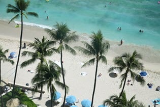 aerial view of a beach with people practicing social distancing