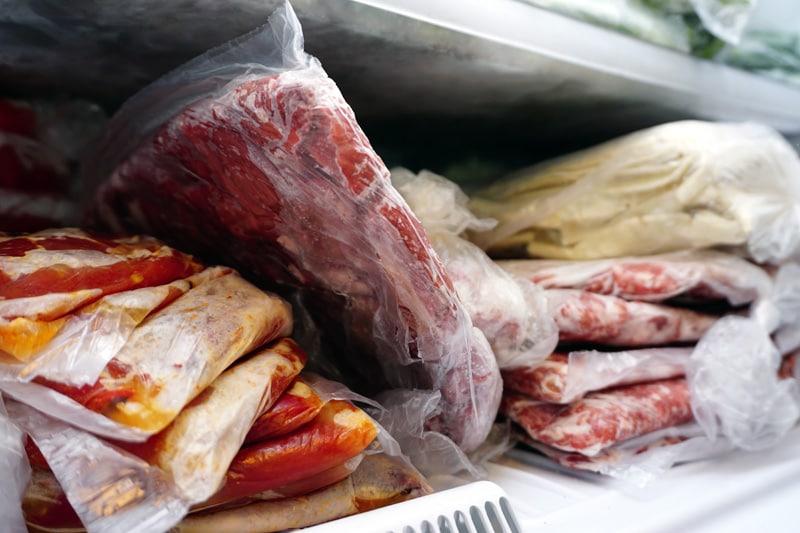 Frozen meat and vegetables in the deep freeze
