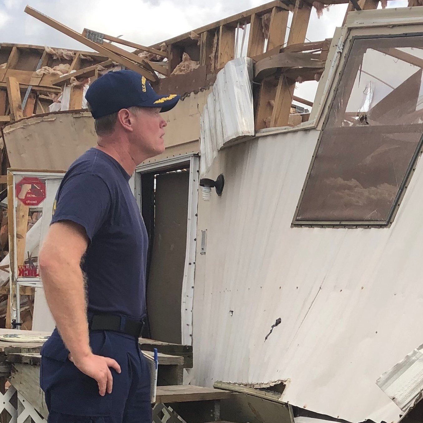 U.S. Public Health Service Capt. Troy Ritter examines a damaged mobile home outside Lake Charles, Louisiana
