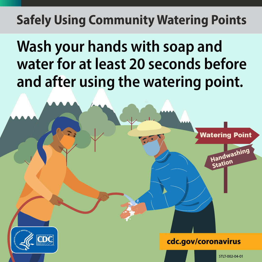 image of 2 people cleaning their hands at a community watering point.