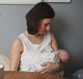 Image of Mother breastfeeding infant