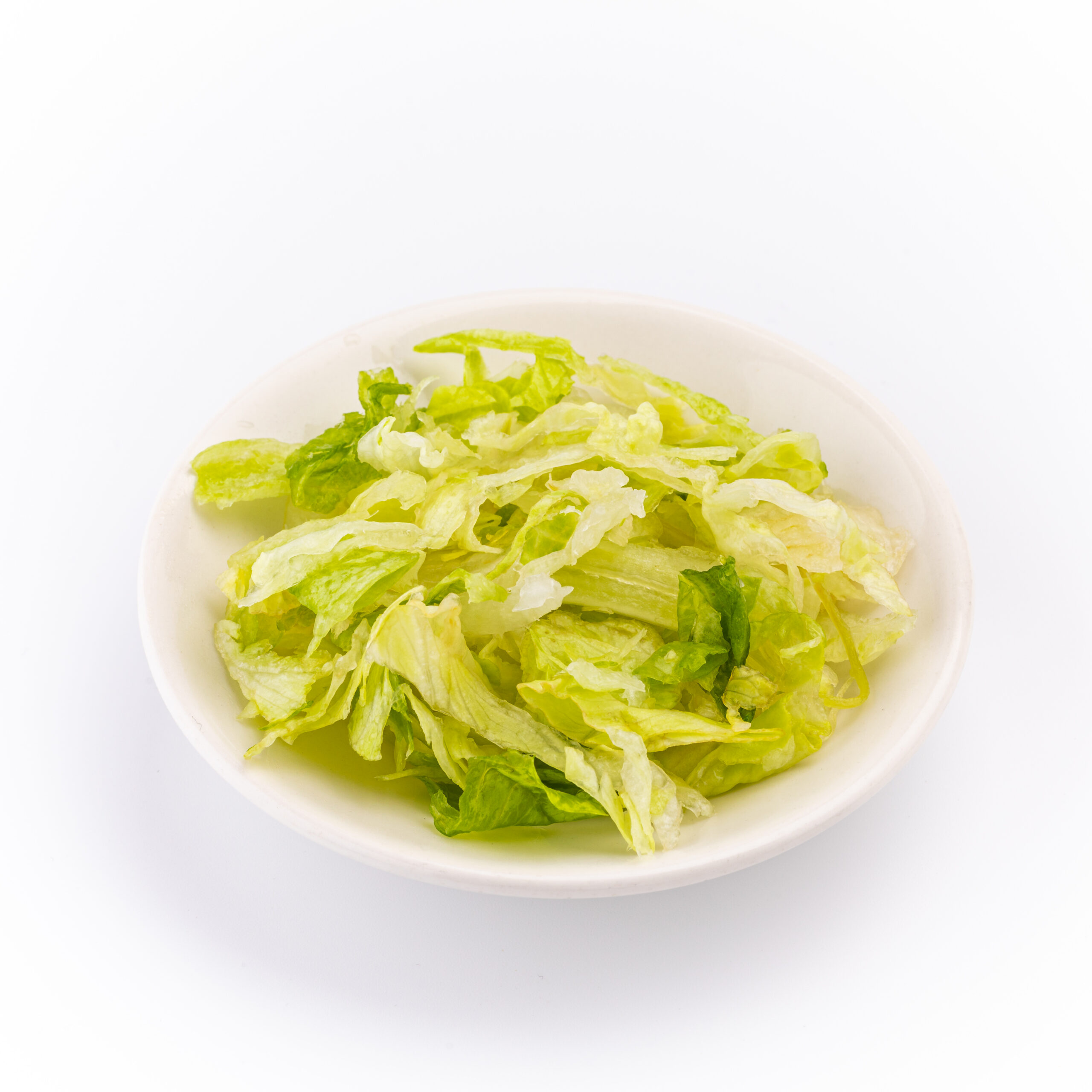 Bowl of shredded iceberg lettuce.