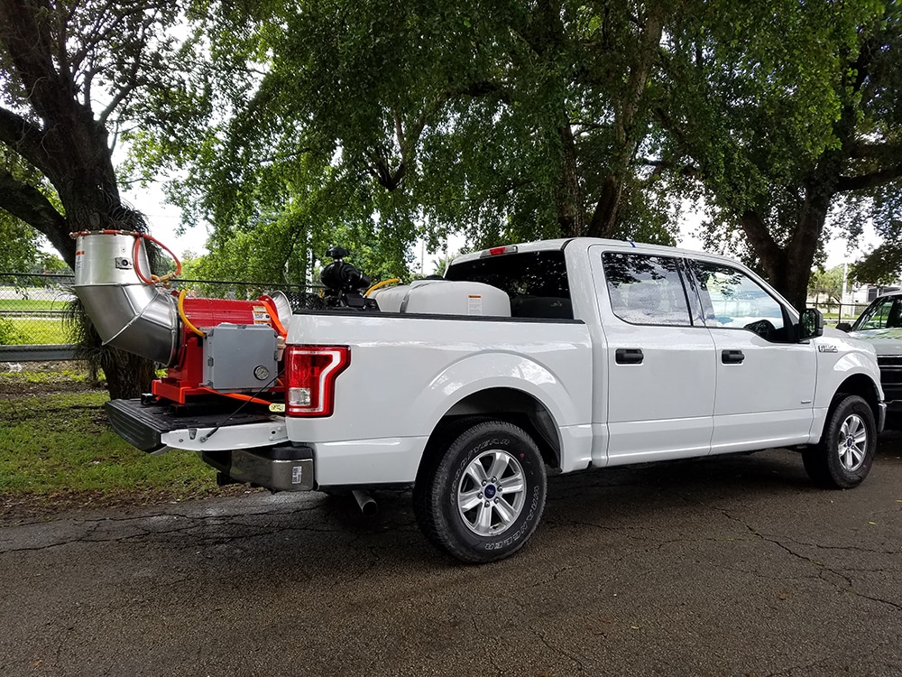 A truck with a sprayer used to apply larvicides. Other similar types of sprayers are available and can be fit onto trucks or a trailer.