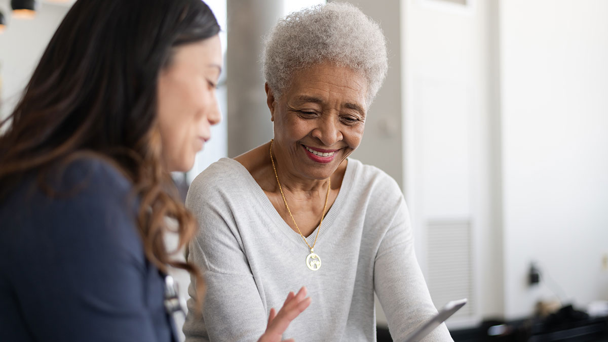 smiling patient talking to educator